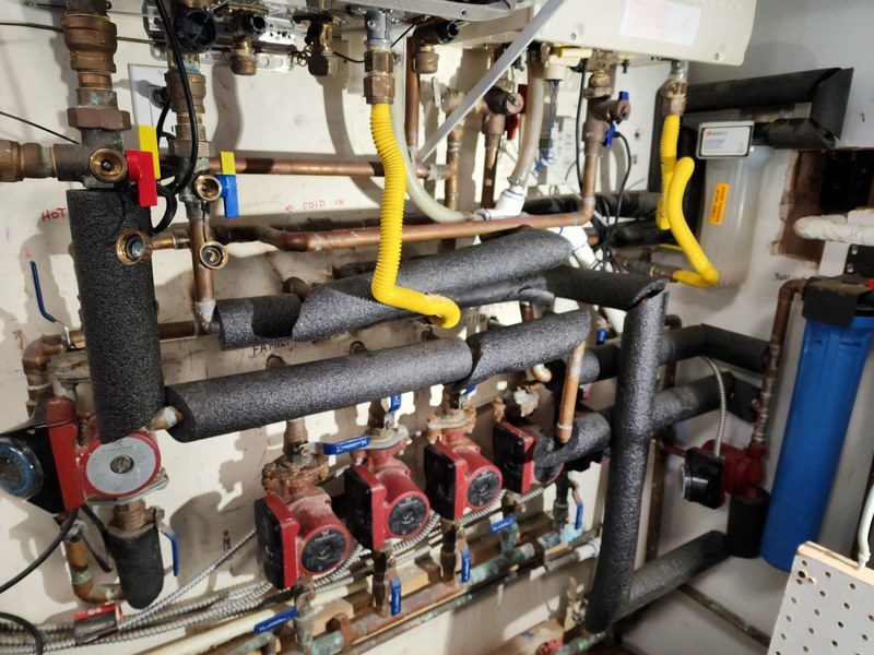 Commercial plumbing service in Orange County: commercial mechanical room serviced by Professional Plumbing