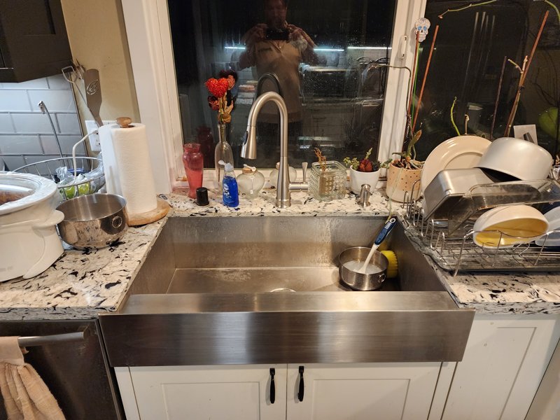 Irvine fixture installation: a kitchen sink faucet in a planned-community home
