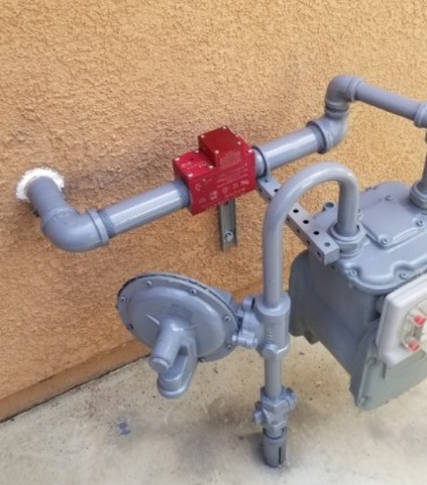 Earthquake gas shut-off valve installed on the outlet side of a residential gas meter in Orange County