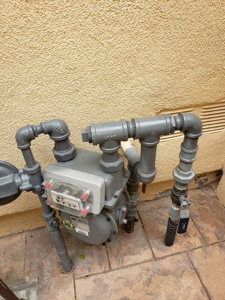Gas meter riser installation on an Irvine home