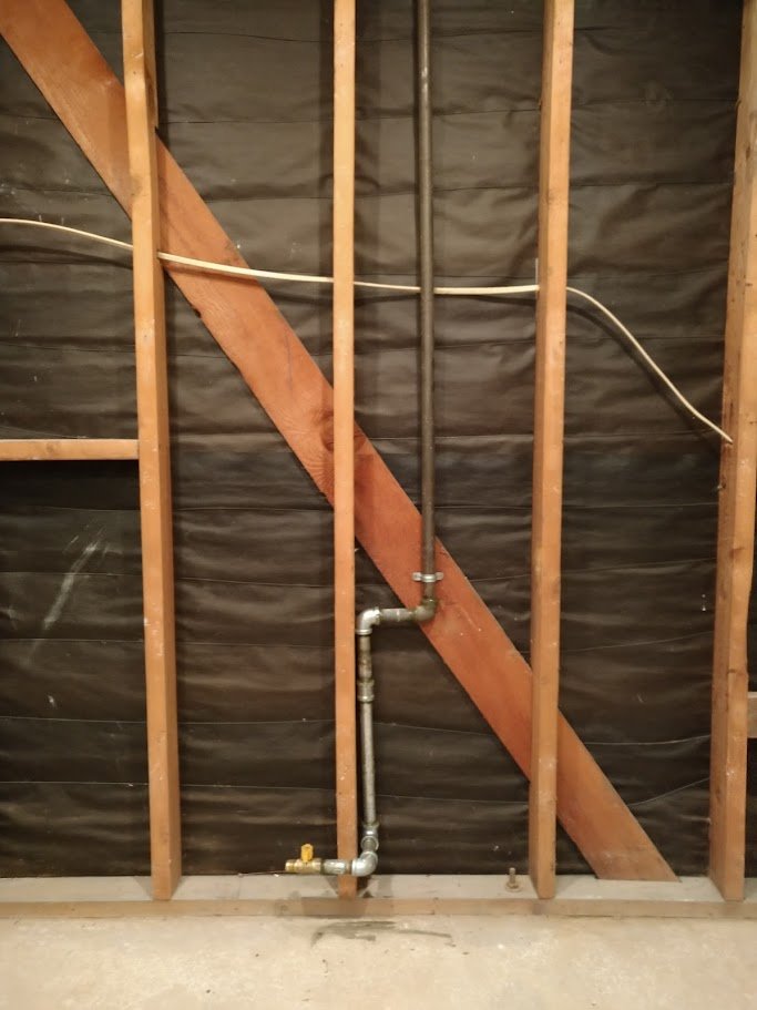 Orange County plumber rerouting a gas line to a stove