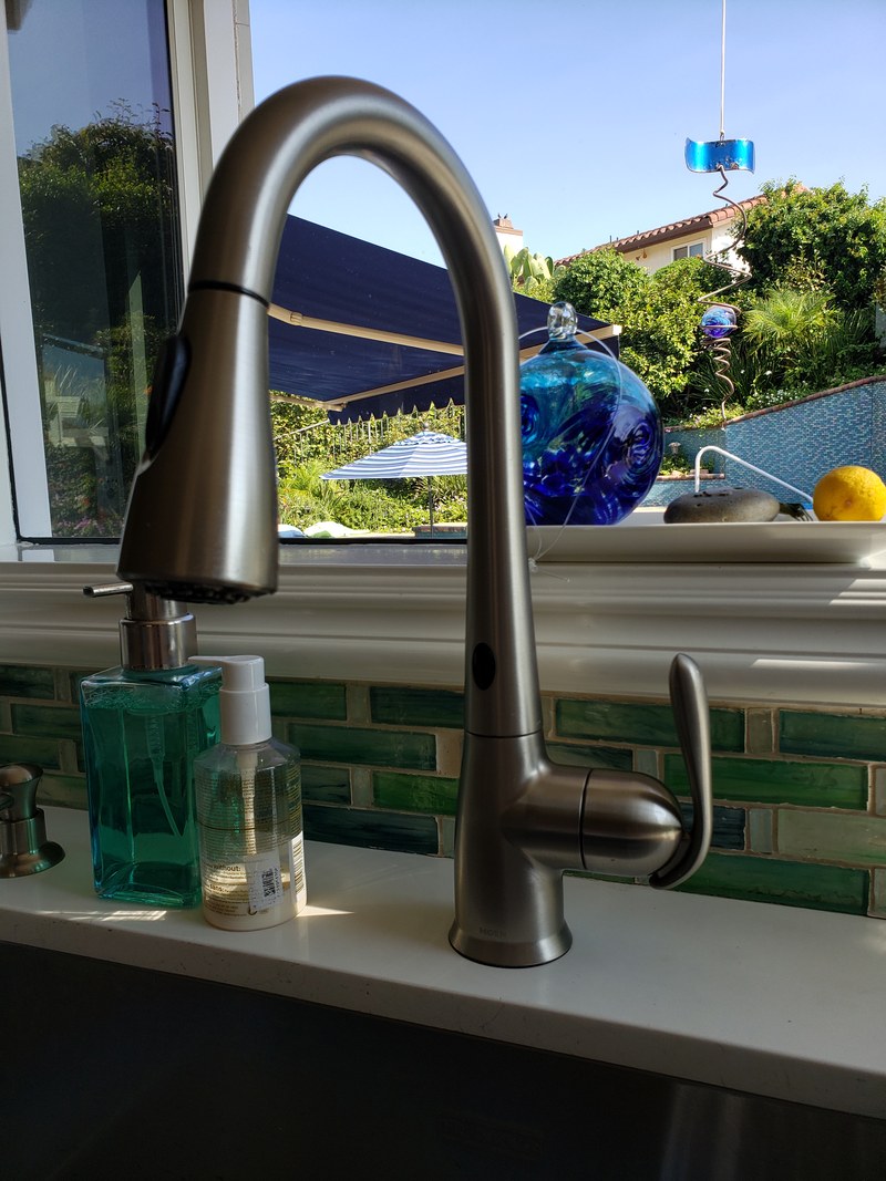 Plumbing fixture installation of a kitchen faucet at an Orange County home