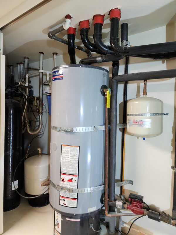 Water heater installed with expansion tank and earthquake straps in Anaheim