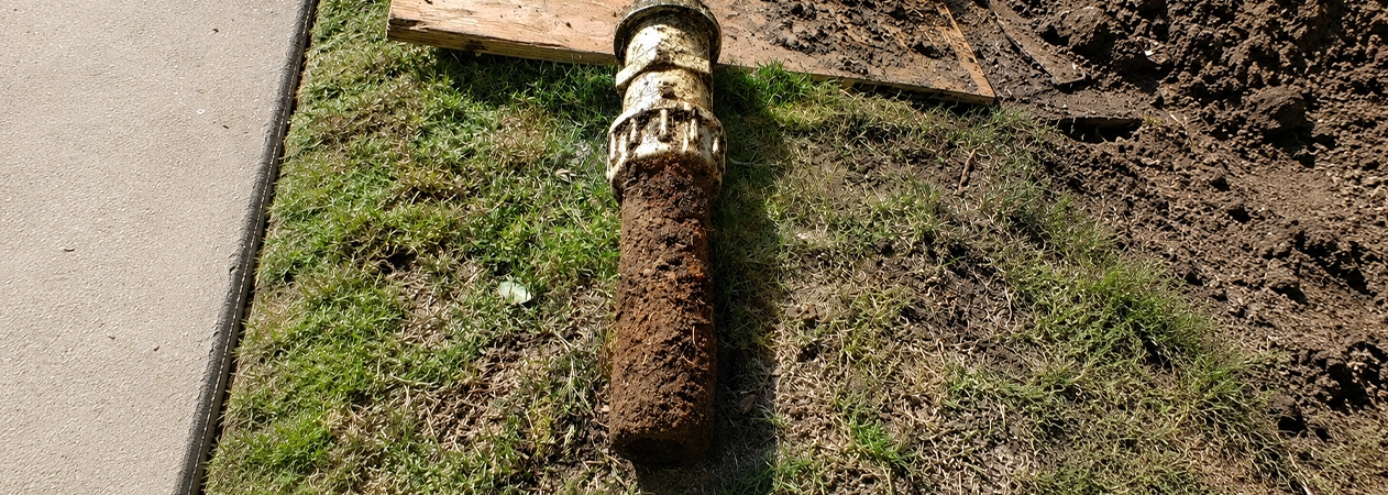 Old clay sewer lateral section pulled during a Costa Mesa drainage service call