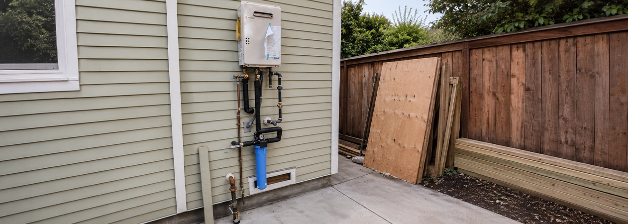 Exterior-mount tankless water heater service on a Newport Beach home Exterior-mount tankless water heater service on a Newport Beach home