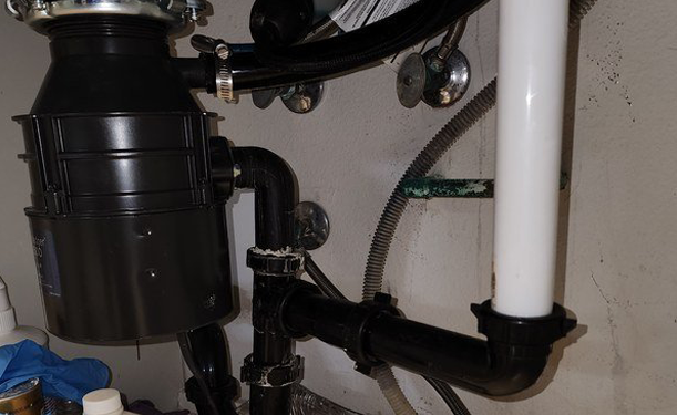 Garden Grove cast-iron drain replaced with new ABS under a kitchen sink Garden Grove cast-iron drain replaced with new ABS under a kitchen sink