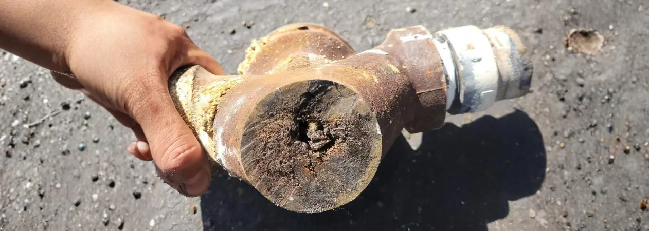 Corroded cast iron drain section removed during a Garden Grove drainage service call Corroded cast iron drain section removed during a Garden Grove drainage service call