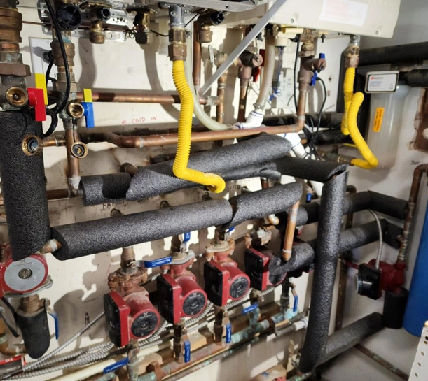 Huntington Beach commercial water heating manifold in a mechanical room Huntington Beach commercial water heating manifold in a mechanical room