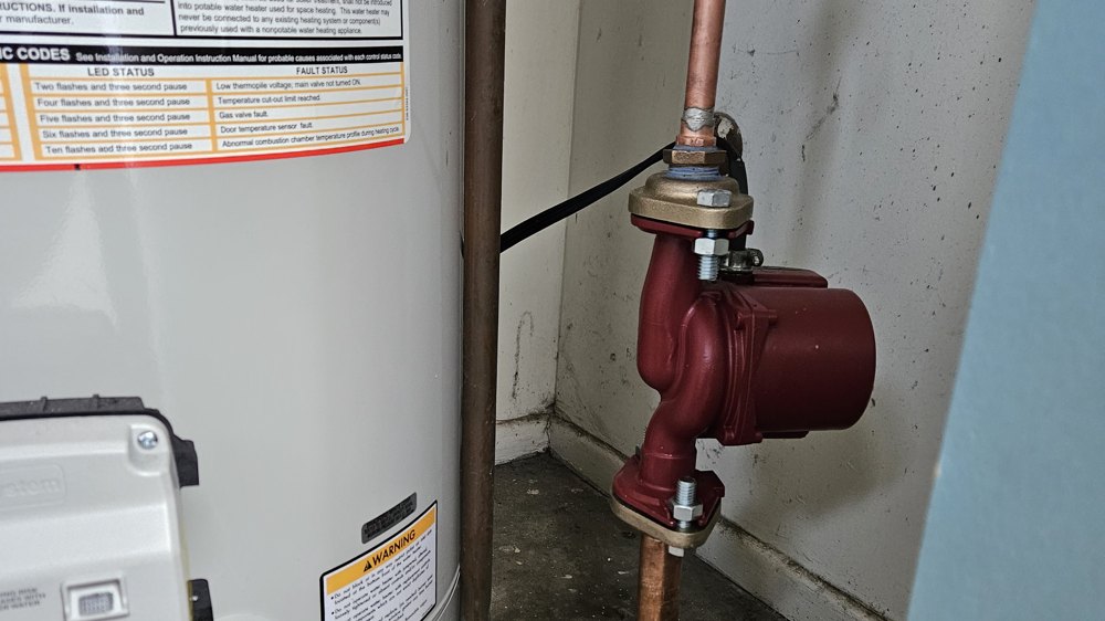Tank water heater with a hot-water recirculation pump installed in Orange County