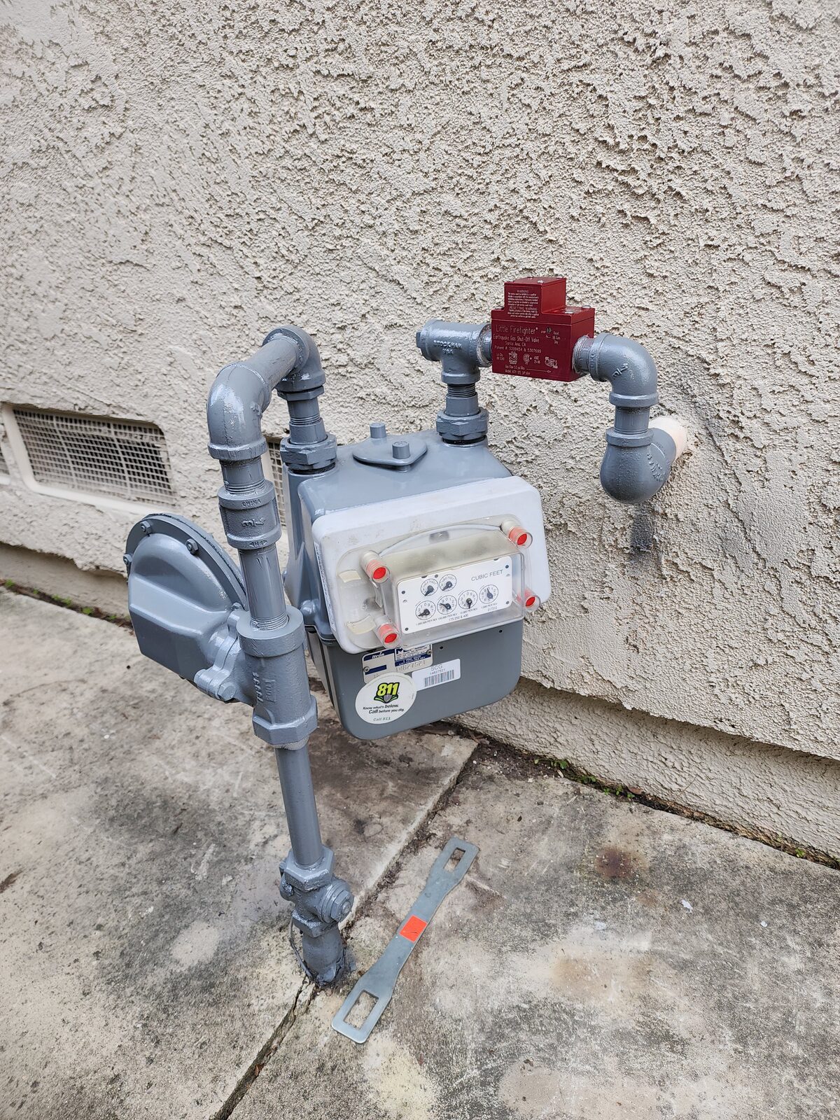 Completed earthquake gas shutoff valve install on an Orange County residential gas meter with clean piping and valve set in the certified orientation