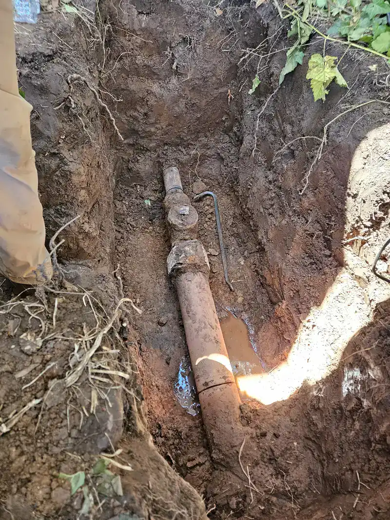 Old clay sewer line exposed in an open trench on a Fountain Valley sewer repair job