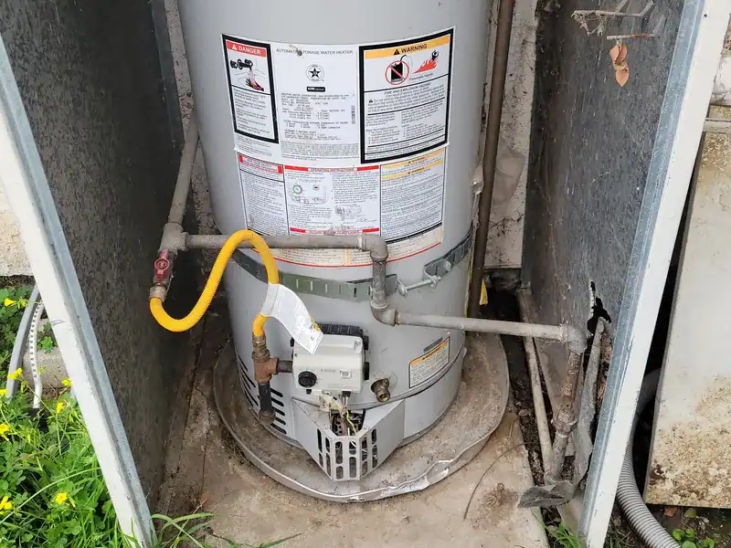 Gas tank water heater in an outdoor closet, a common source of after-hours leaks